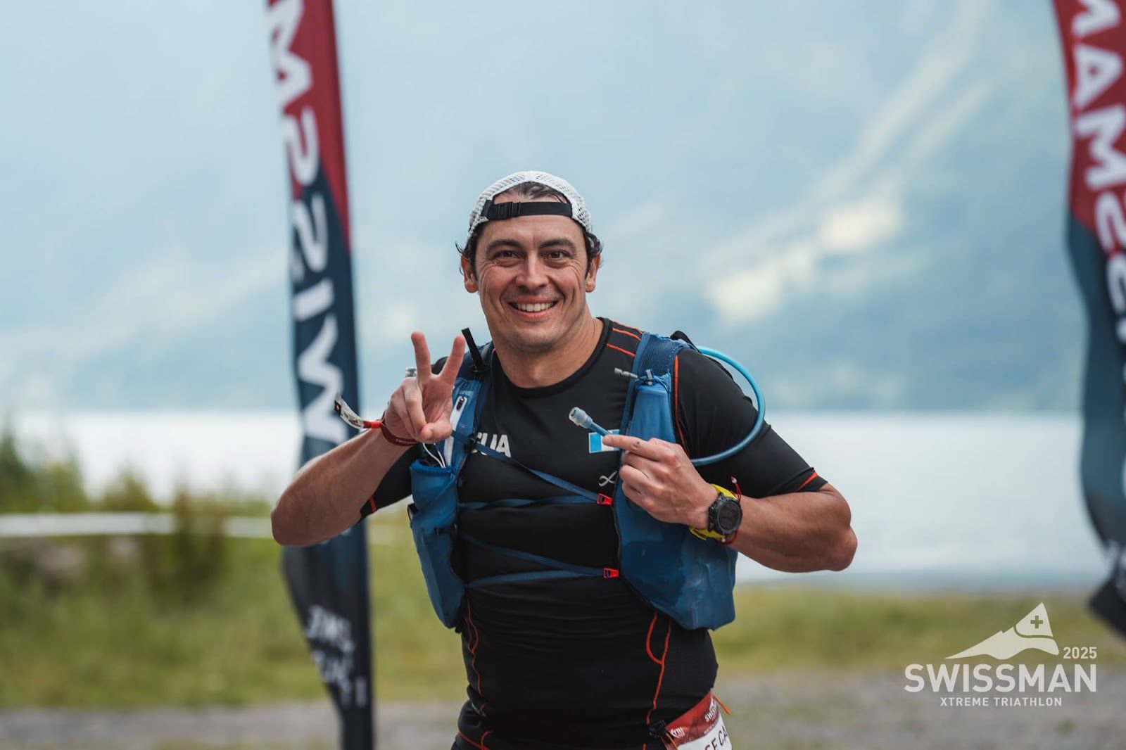 Charlie Sarmiento celebrating the Swissman Xtreme Triathlon finish